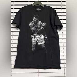 #2) Ali 100% T-Shirt Size Large